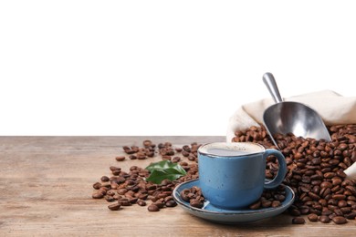 Photo of Cup of aromatic hot coffee and beans on wooden table against white background