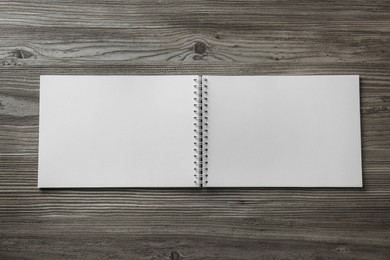 Blank paper brochure on wooden table, top view. Mockup for design