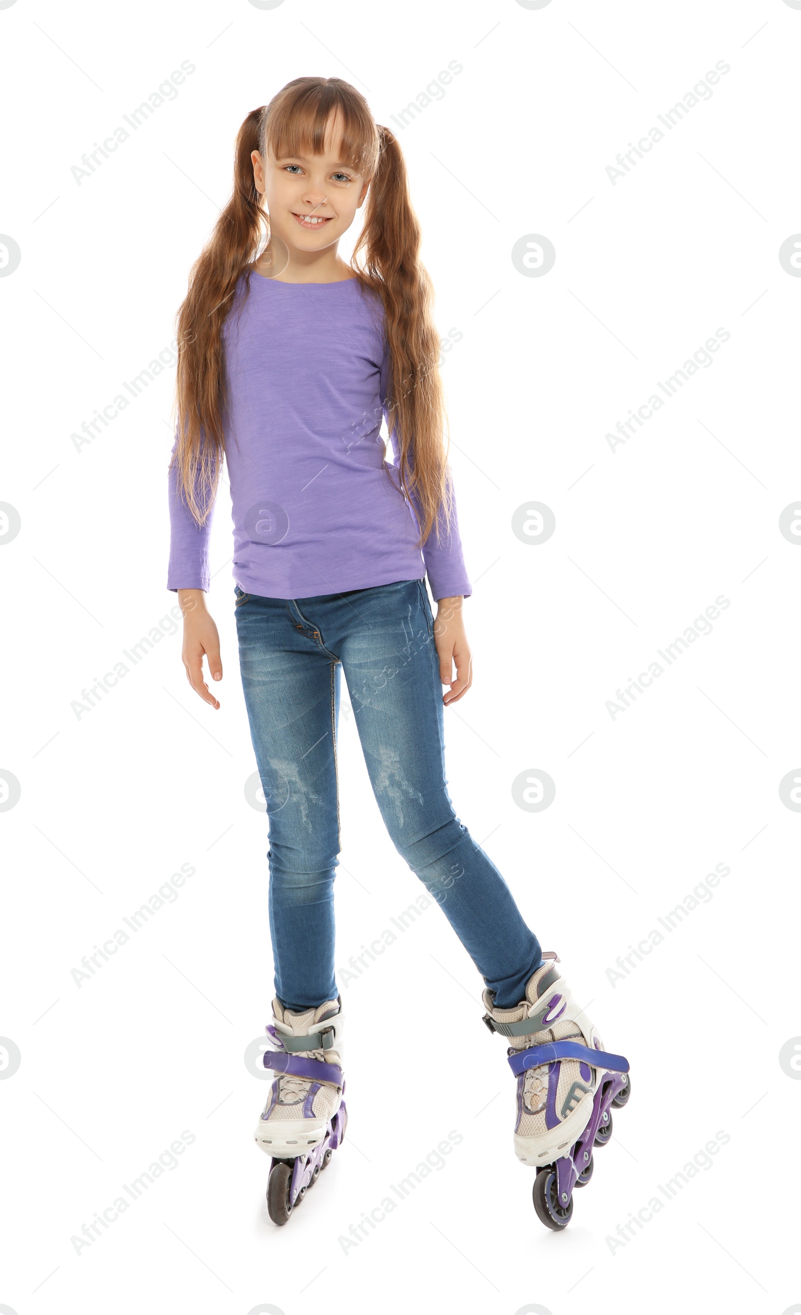 Photo of Full length portrait of girl with inline roller skates on white background