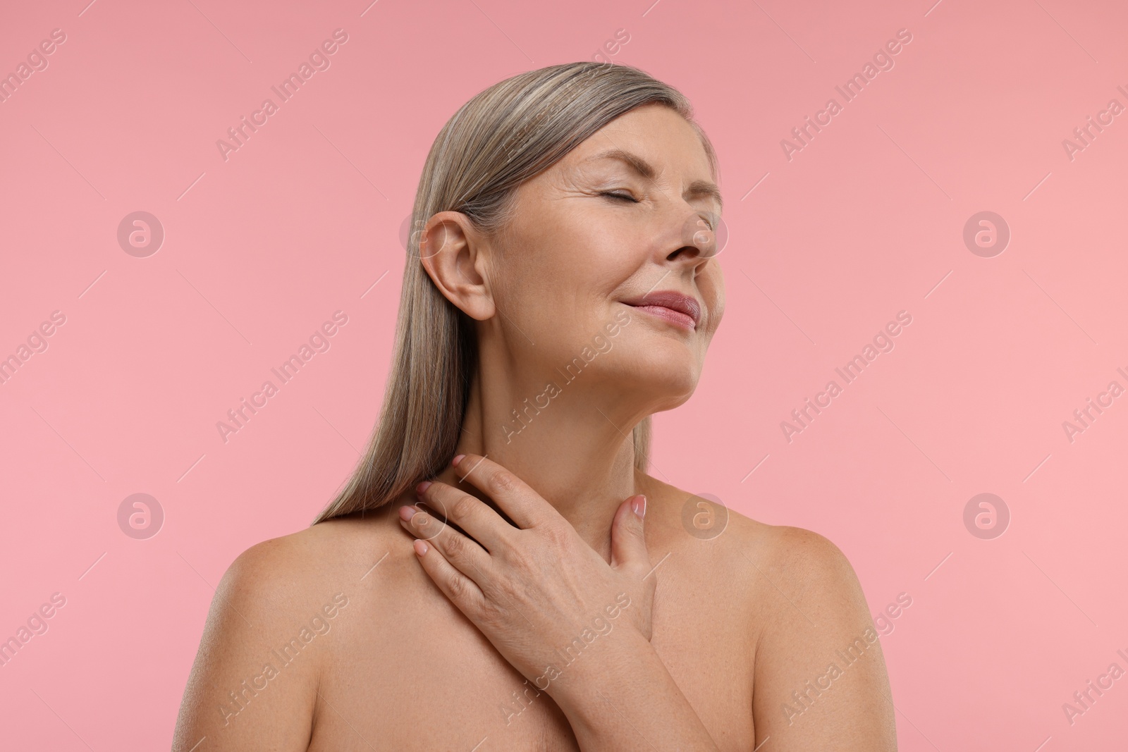 Photo of Beautiful woman with healthy skin on pink background