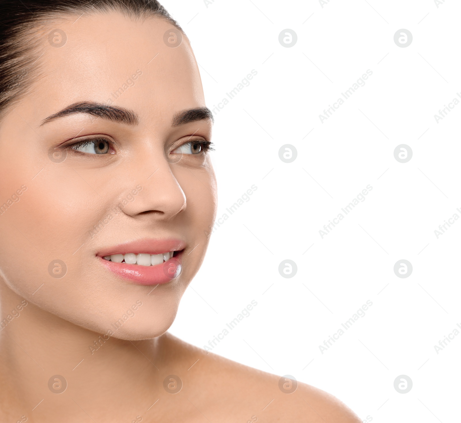 Photo of Portrait of young woman with beautiful face and natural makeup on white background, closeup