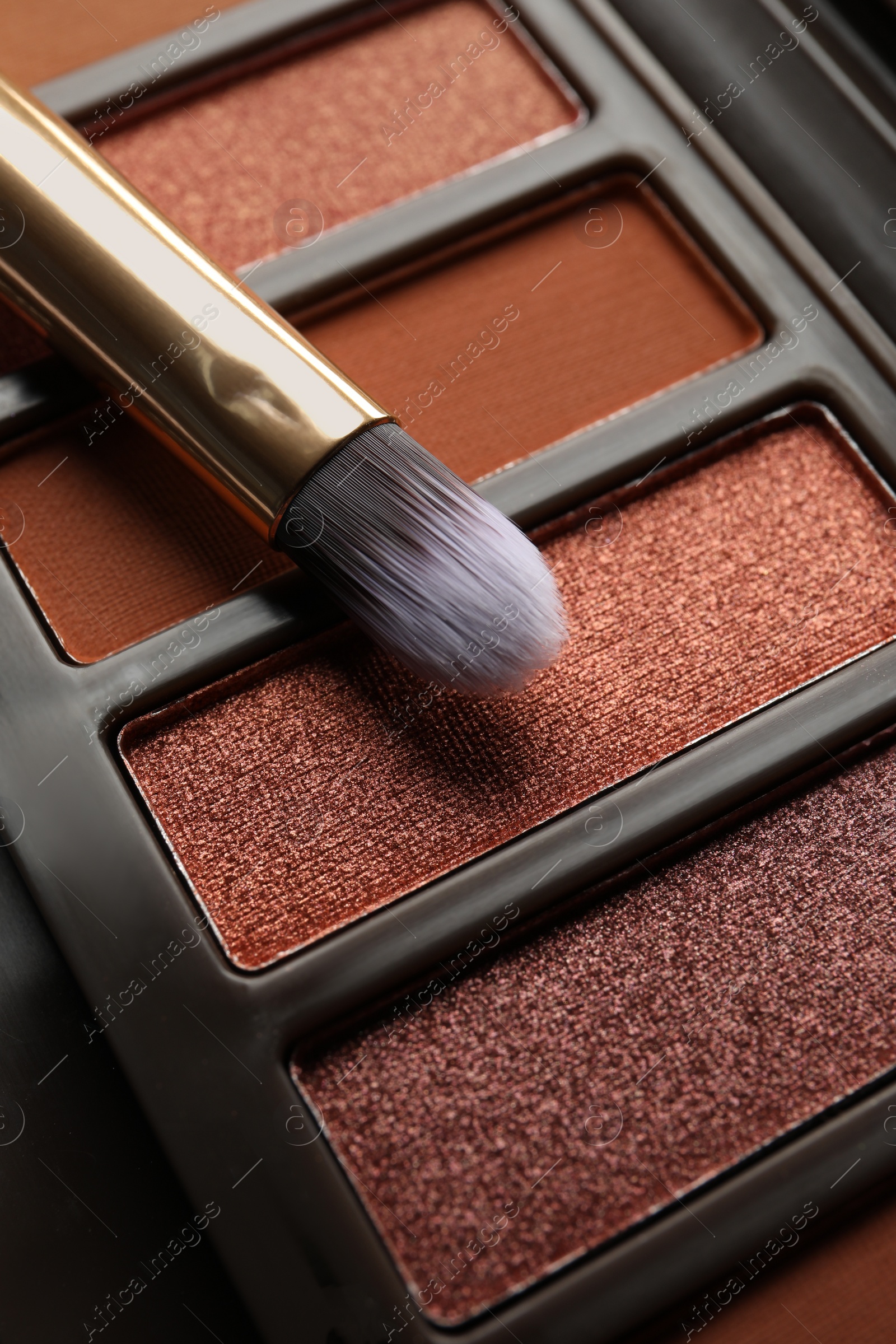 Photo of Beautiful eye shadow palette and brush as background, closeup