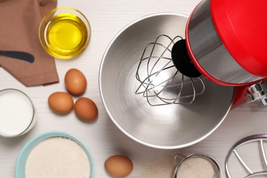 Photo of Modern red stand mixer and different ingredients on white wooden table, flat lay