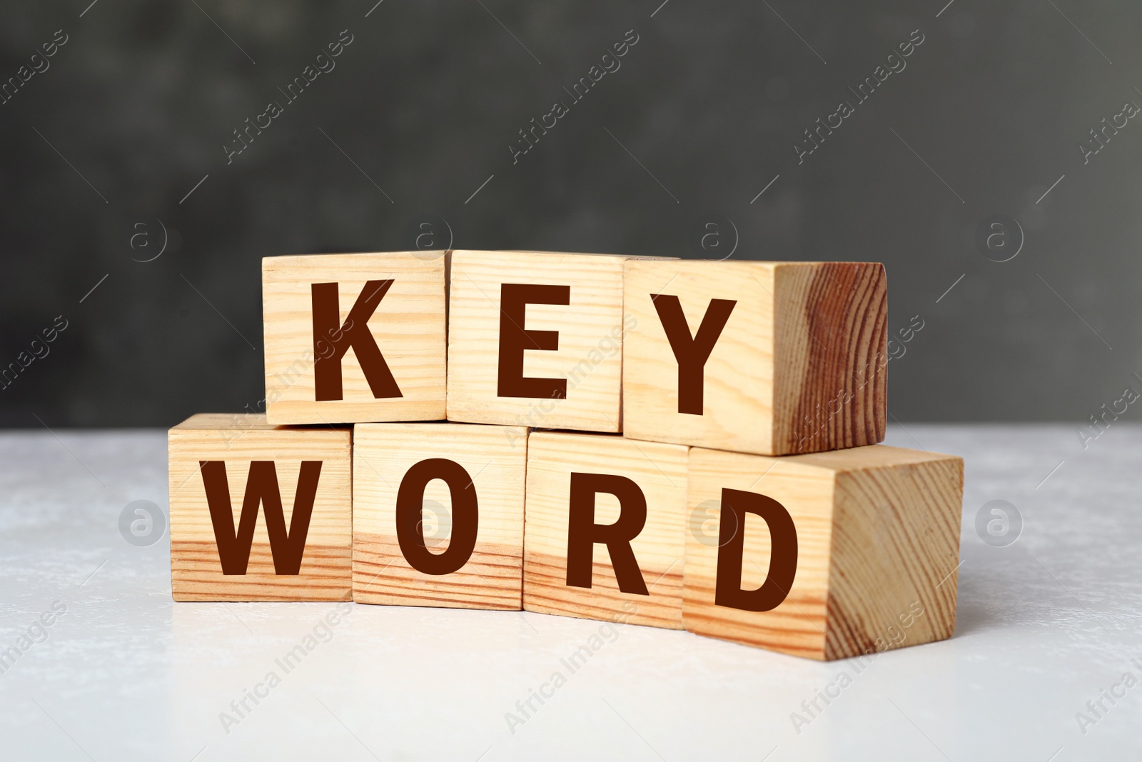 Photo of Wooden cubes with word KEYWORD on white table