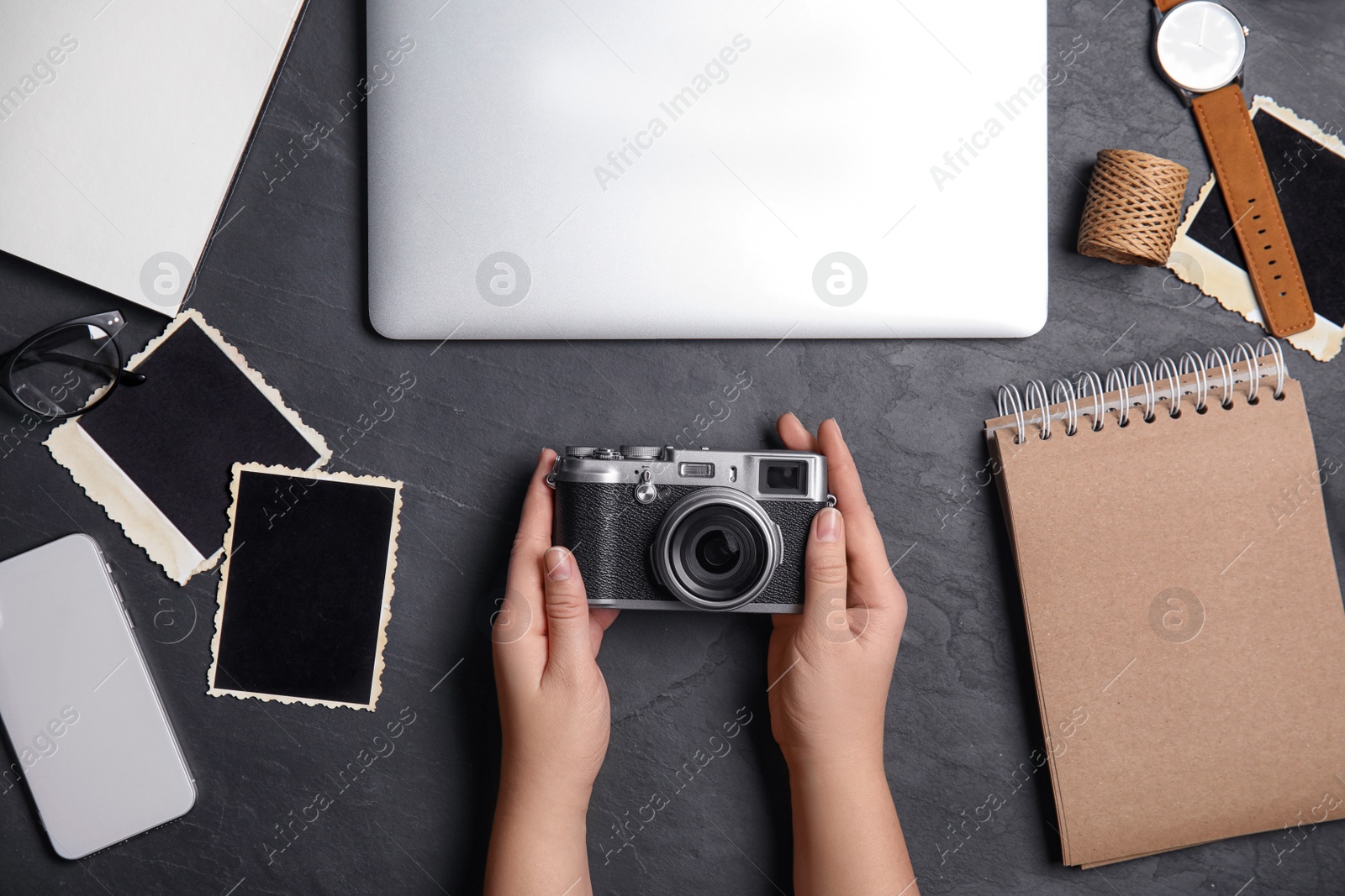 Photo of Professional designer with camera at workplace, top view