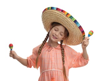 Cute girl in Mexican sombrero hat dancing with maracas on white background