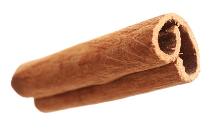 Photo of Dry cinnamon stick isolated on white. Mulled wine ingredient