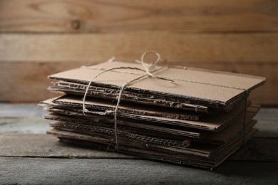 Photo of Stack of waste paper on wooden table