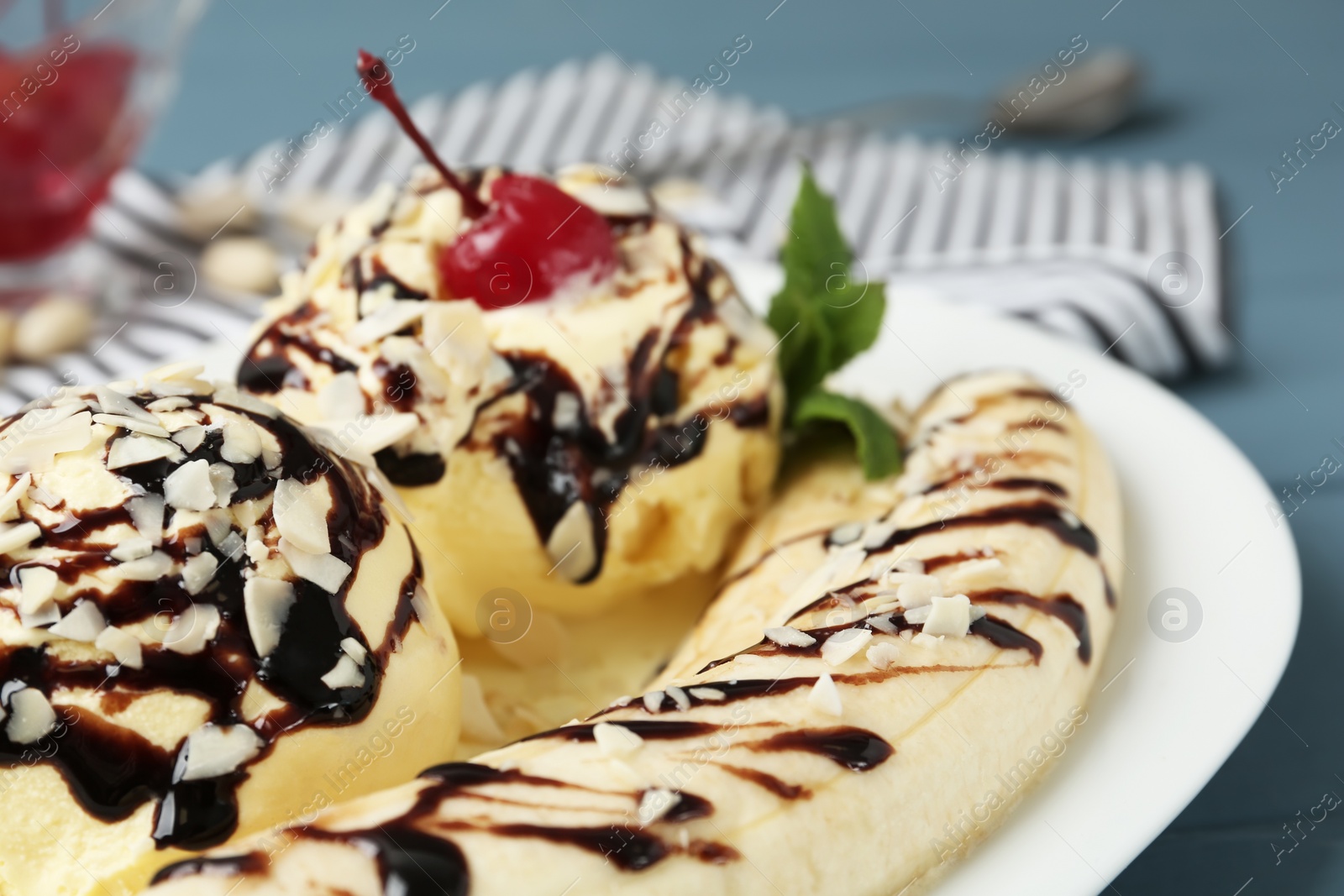 Photo of Delicious dessert with banana ice cream on table, closeup