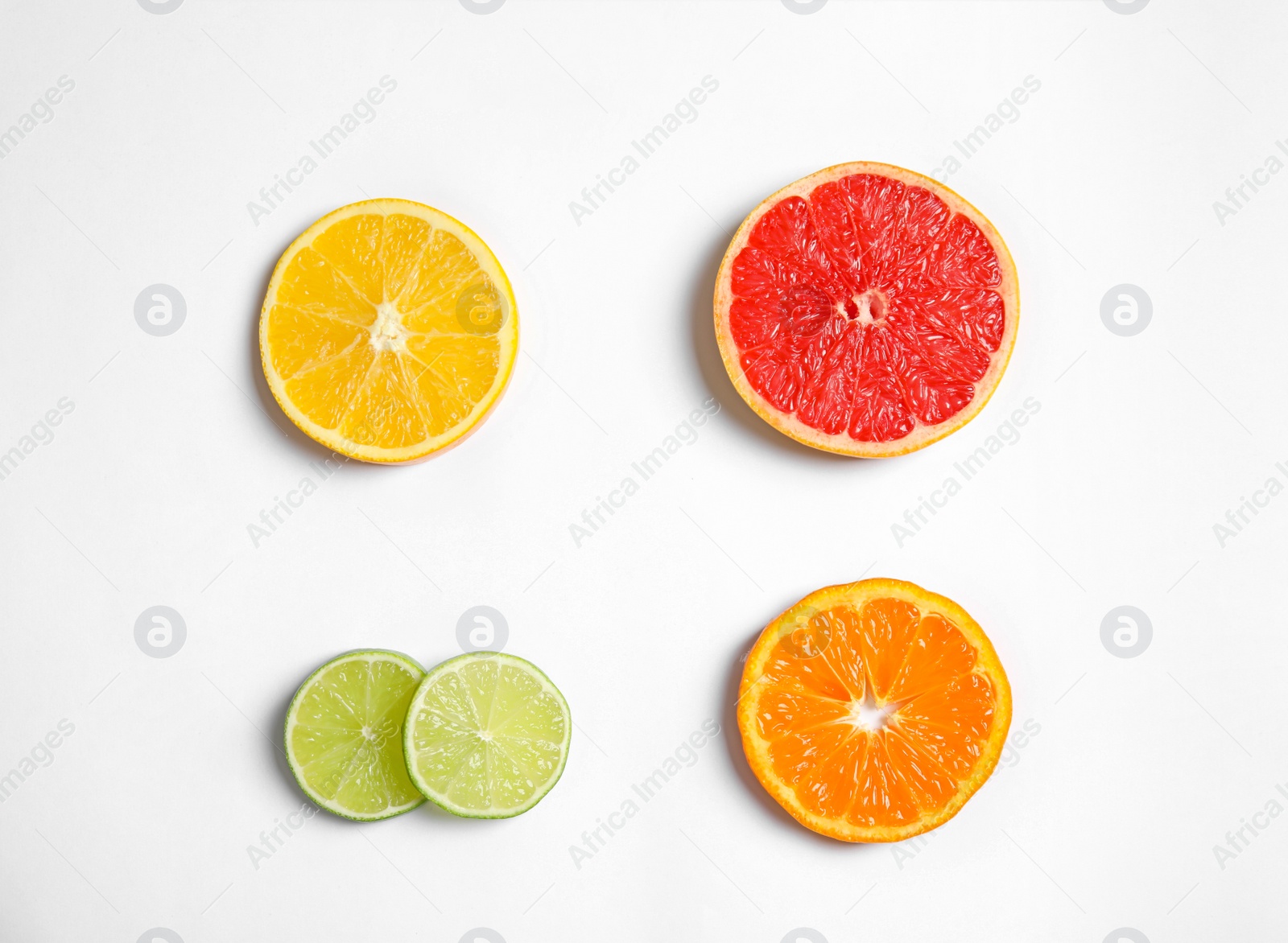 Photo of Different citrus fruits on white background, top view