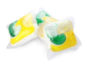 Many dishwasher detergent pods on white background