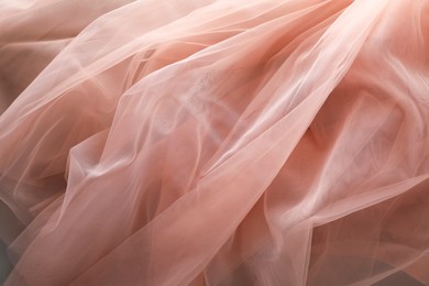 Photo of Beautiful tulle fabric as background, closeup view
