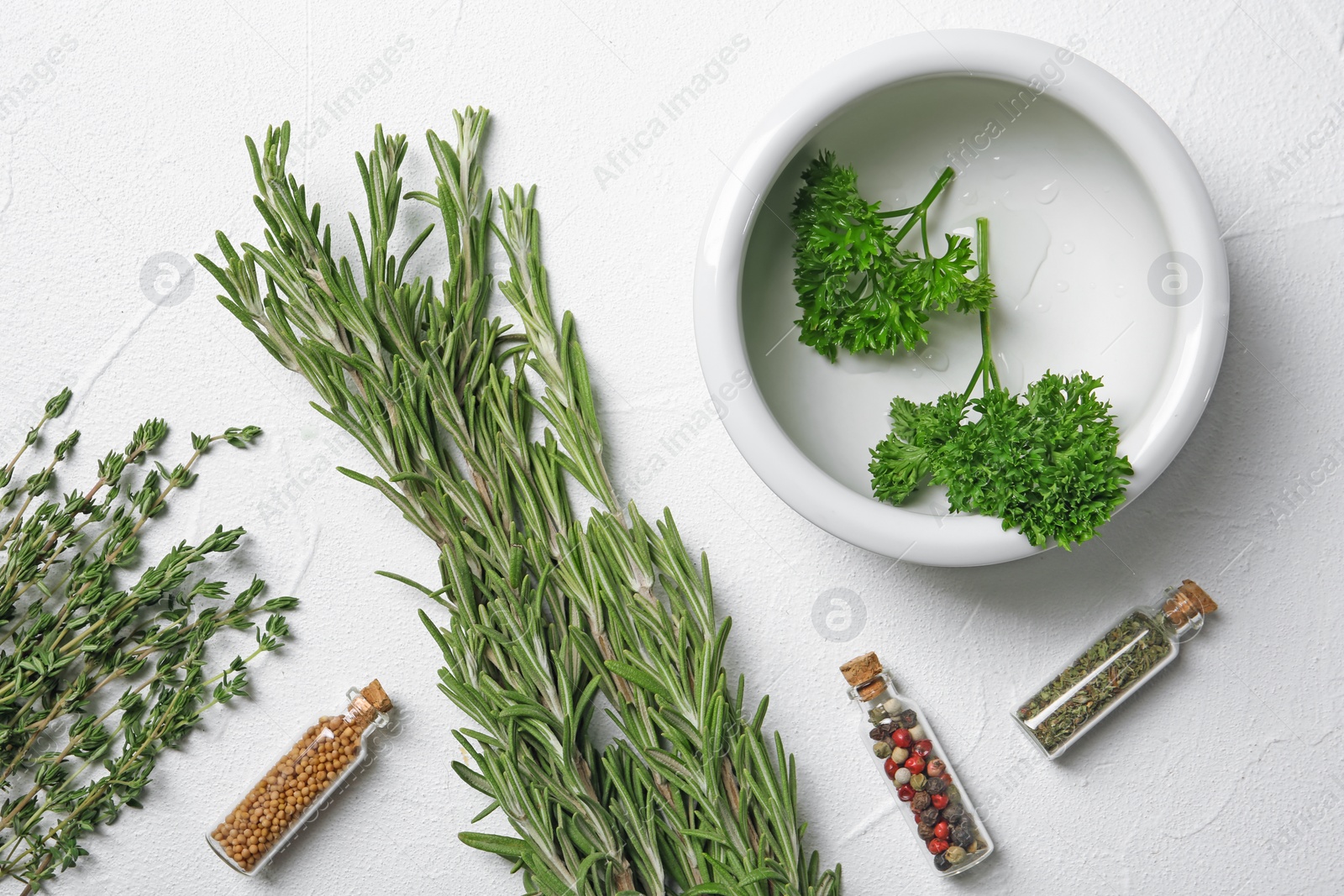 Photo of Flat lay composition with rosemary on light background. Aromatic herbs