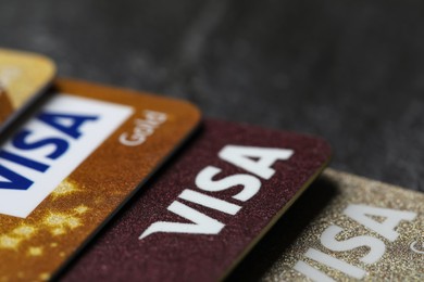 MYKOLAIV, UKRAINE - FEBRUARY 22, 2022: Visa credit cards on black background, closeup