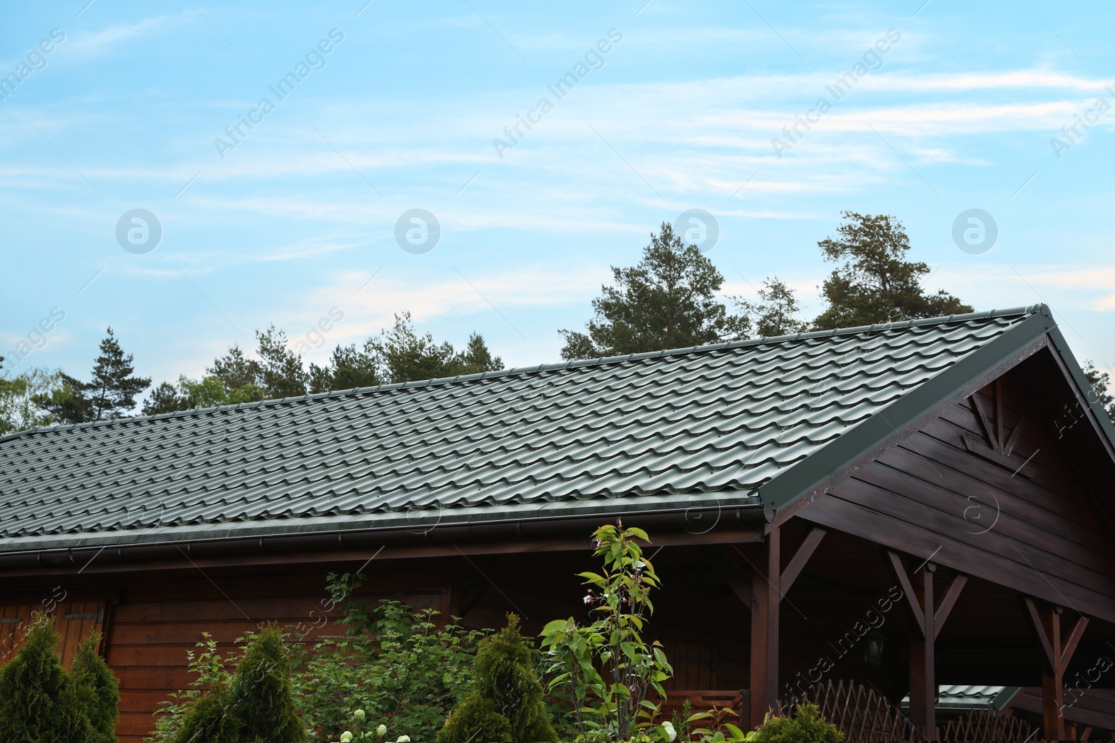 Photo of Modern building with green roof outdoors on spring day