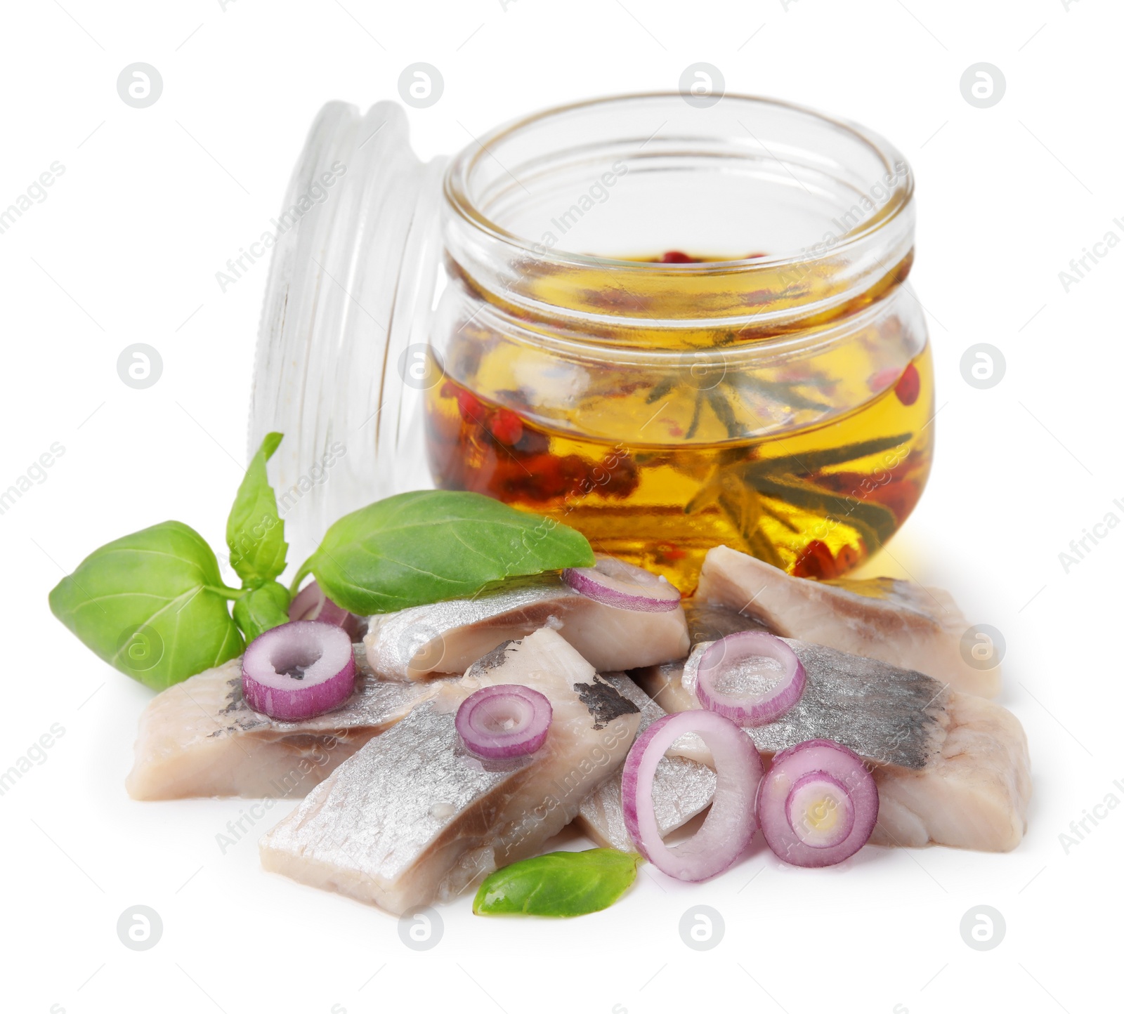 Photo of Pieces of tasty fish, onion, basil and marinade isolated on white