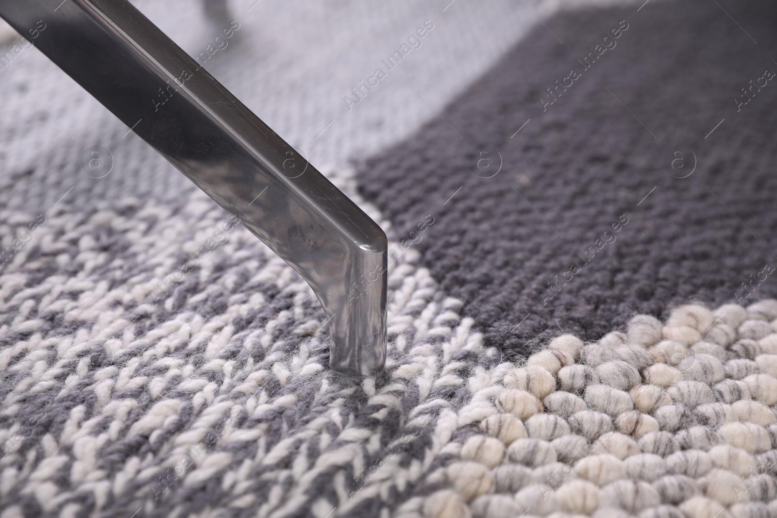 Photo of Modern office chair on carpet, closeup view