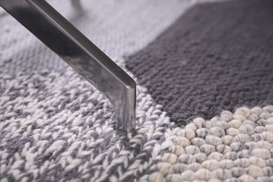 Photo of Modern office chair on carpet, closeup view