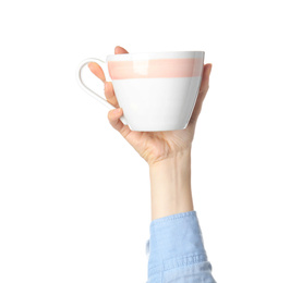 Woman holding ceramic cup on white background, closeup