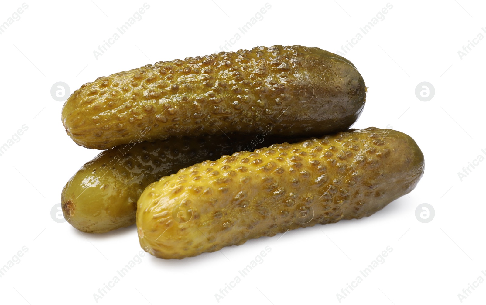 Photo of Pile of tasty pickled cucumbers isolated on white