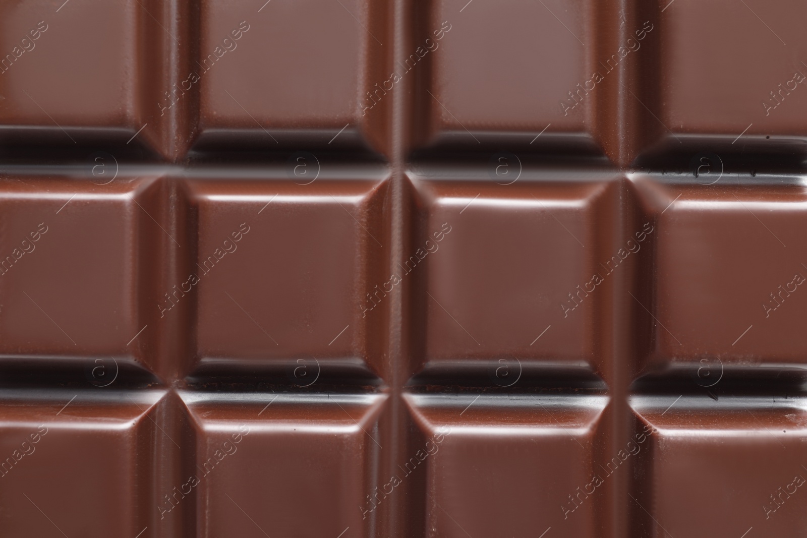 Photo of Tasty dark chocolate bar as background, top view