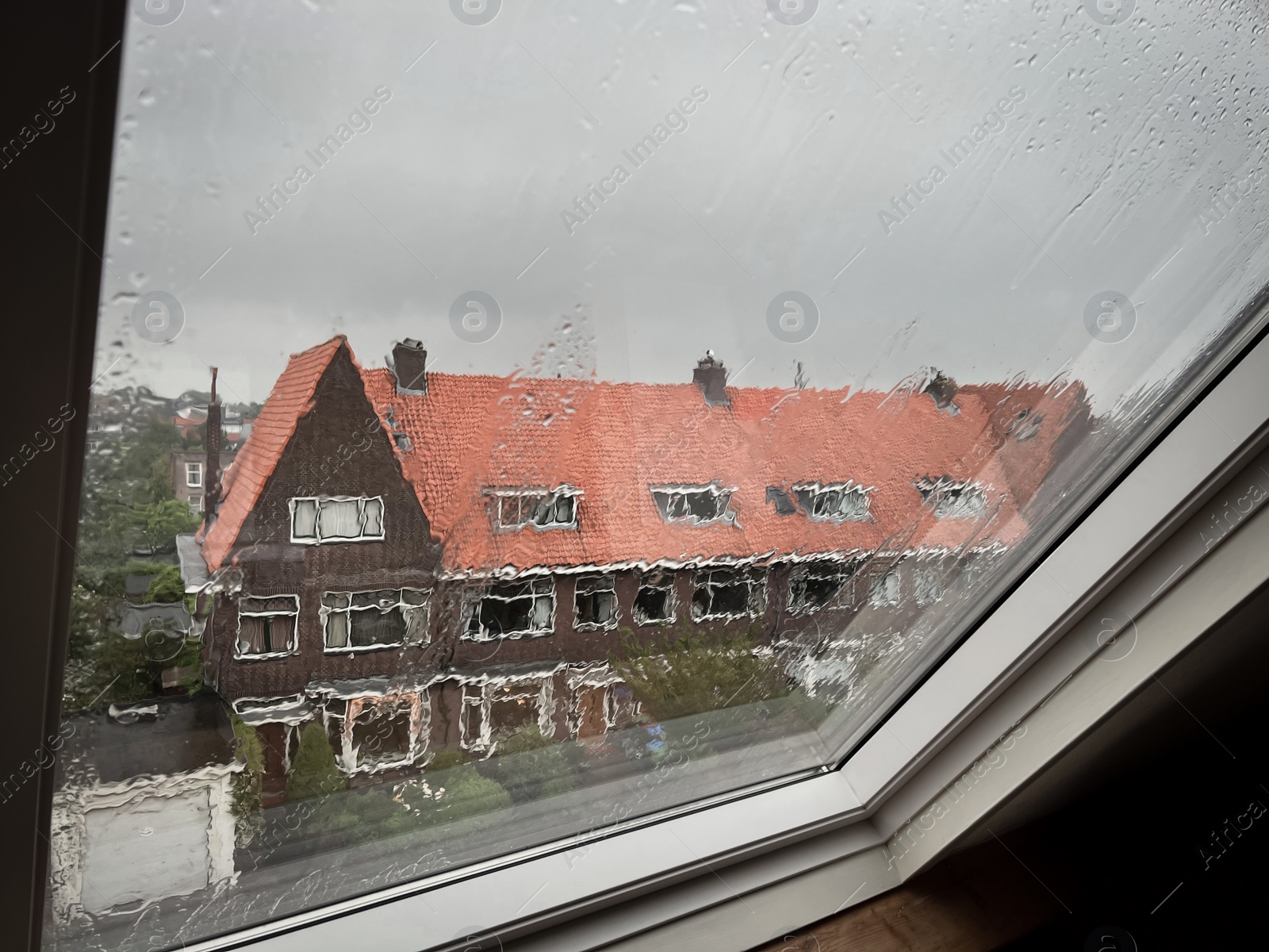 Photo of Window glass with water drops, view from inside. Rainy weather