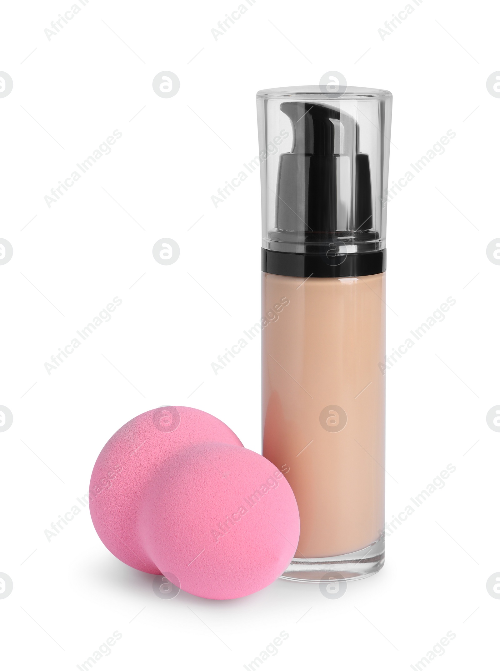 Photo of Bottle of skin foundation and sponge on white background. Makeup product