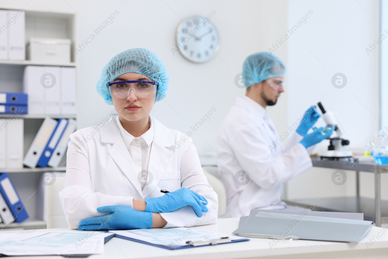 Photo of Quality control. Food inspectors checking safety of products in laboratory