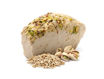 Image of Tasty halva, pistachio nuts and peeled sunflower seeds isolated on white