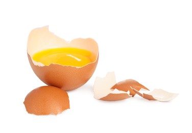 Photo of One cracked chicken egg isolated on white