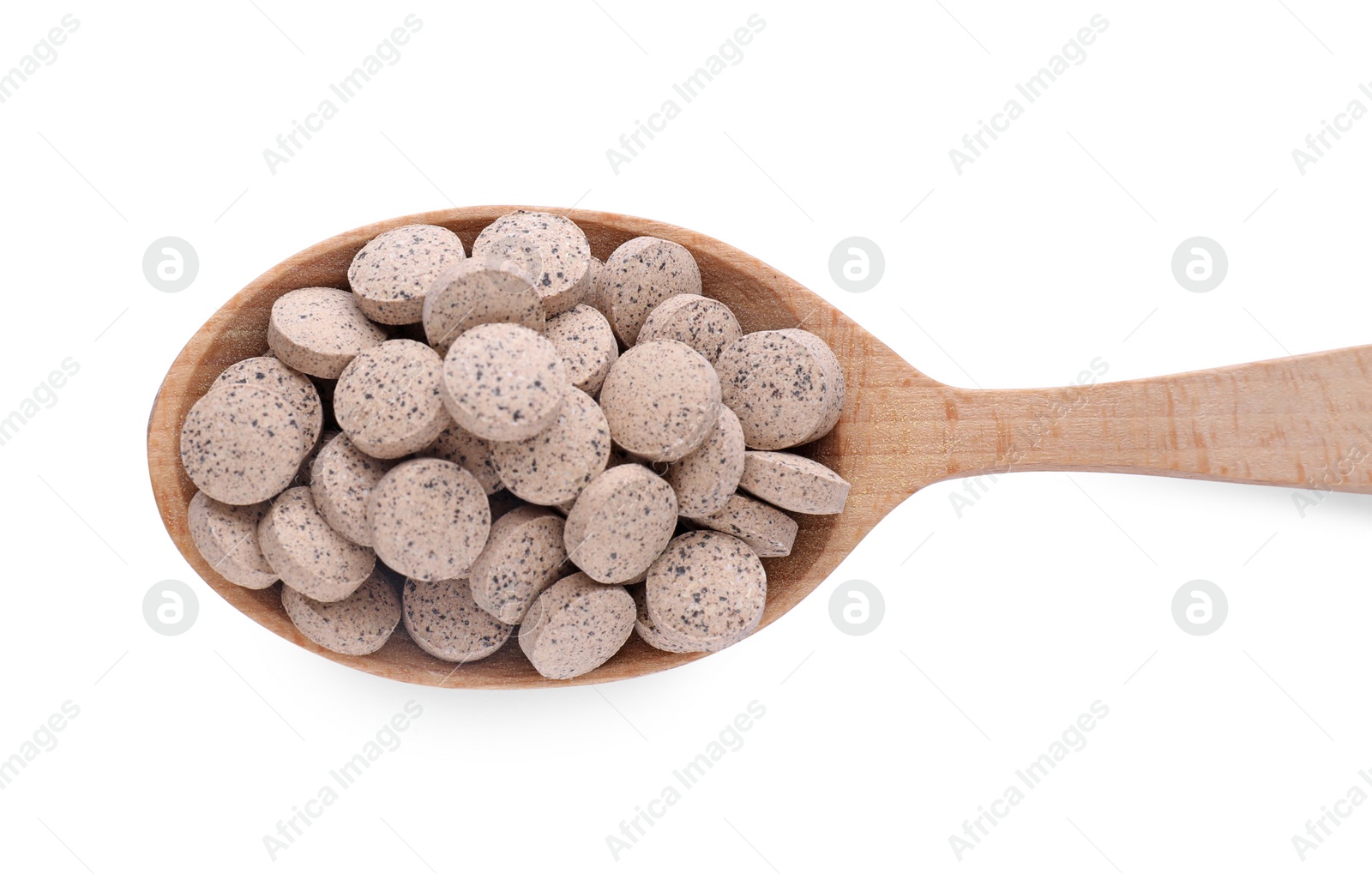 Photo of Brewer's yeast tablets in spoon isolated on white, top view