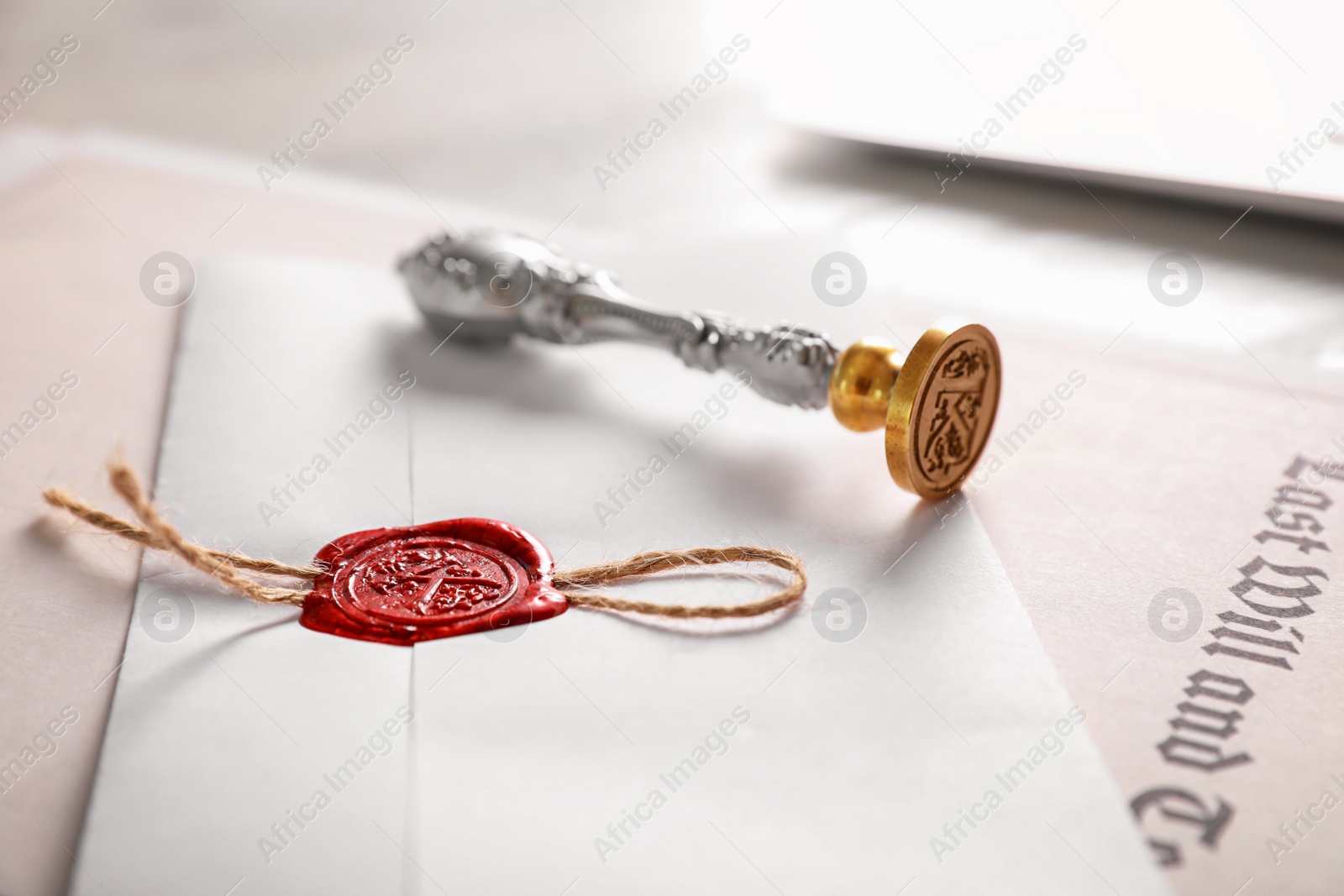 Photo of Vintage notary stamp and documents on desk, closeup