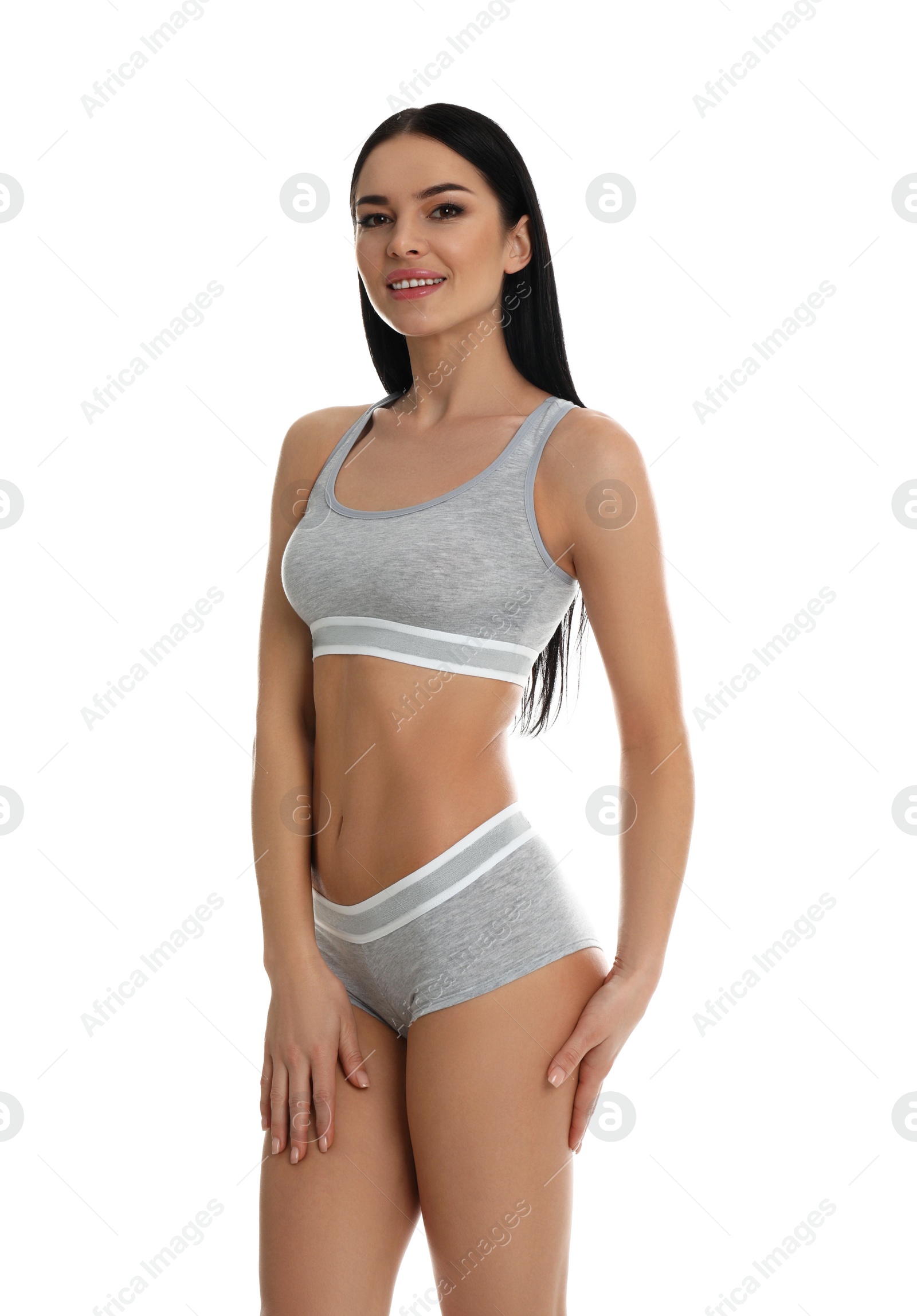 Photo of Beautiful young woman in grey sportive underwear isolated on white