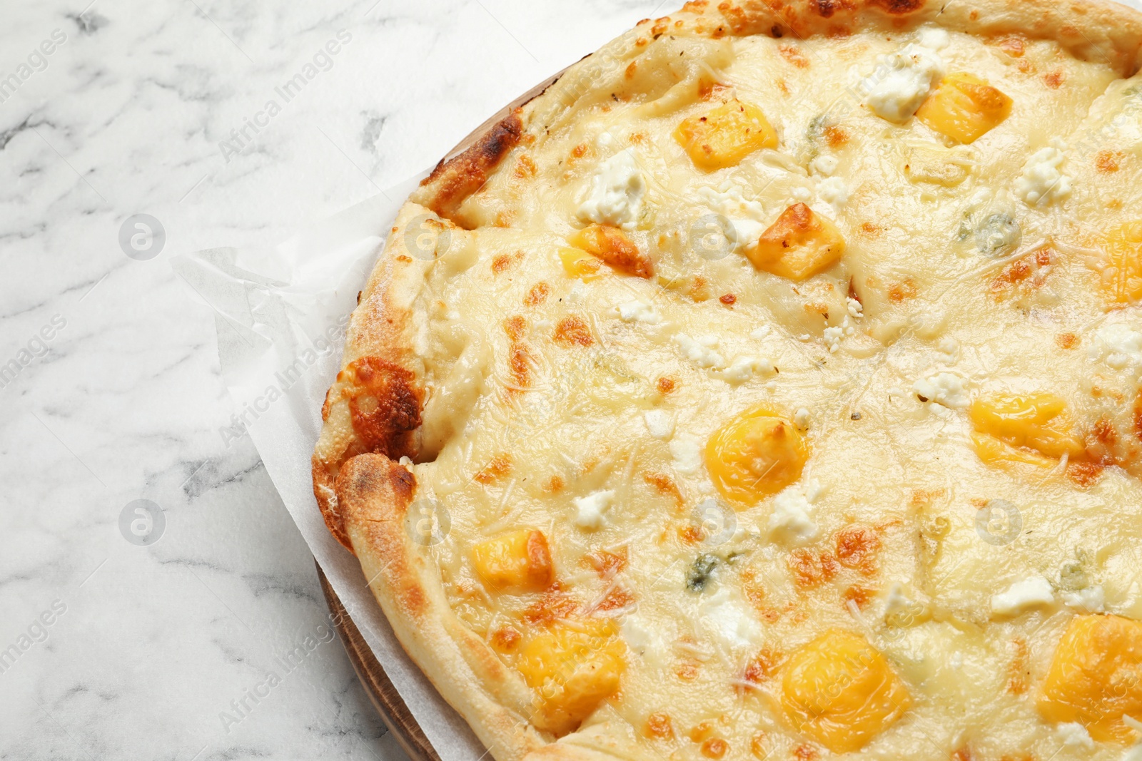 Photo of Hot cheese pizza Margherita on marble table, closeup