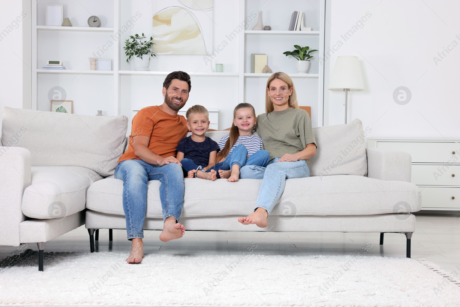 Photo of Portrait of happy family with children on sofa at home