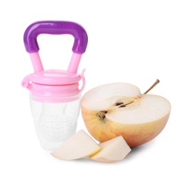 Photo of Empty nibbler and cut apple on white background. Baby feeder