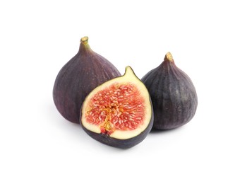 Photo of Cut and whole ripe figs isolated on white