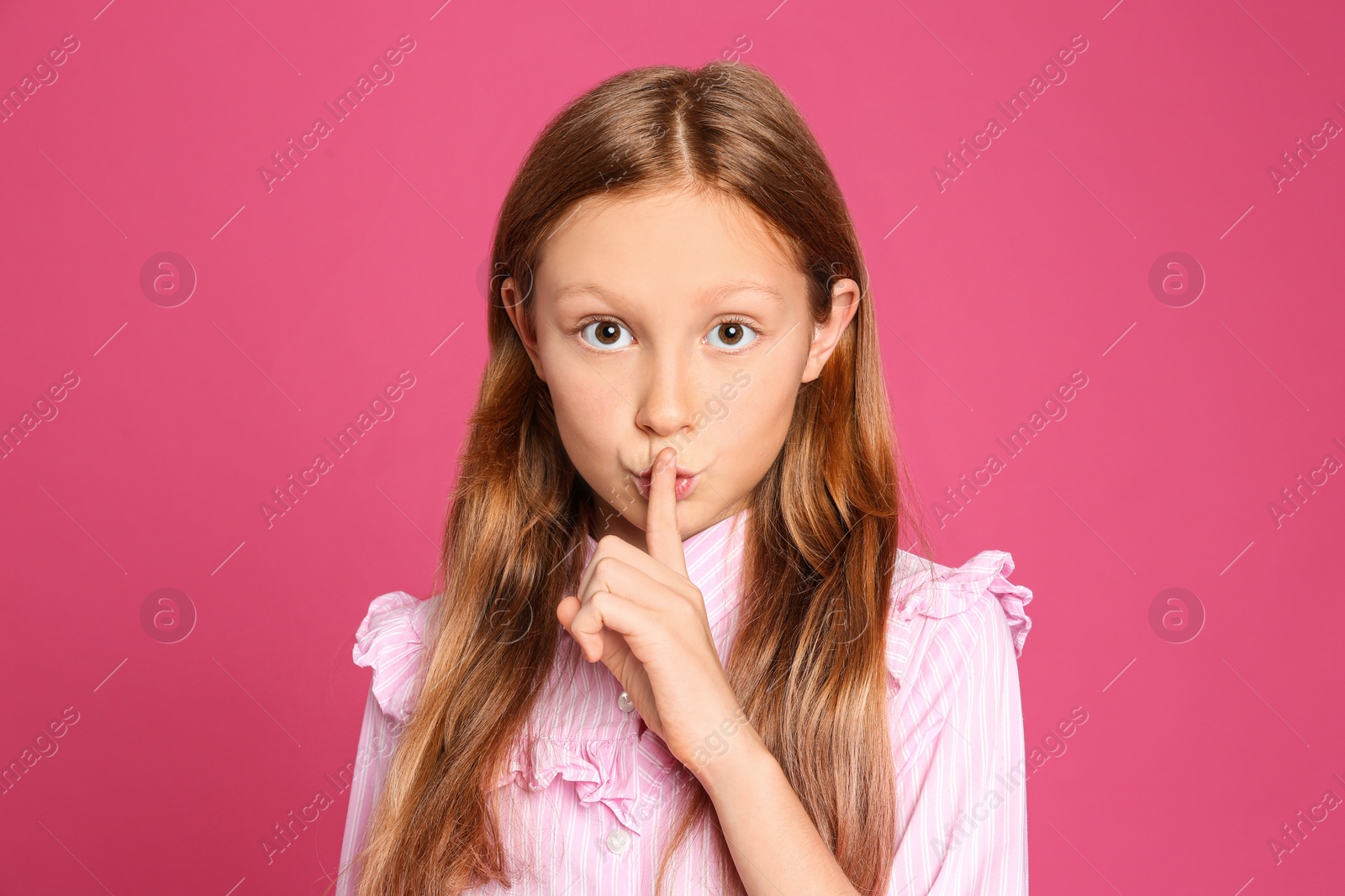 Photo of Portrait of emotional preteen girl on pink background