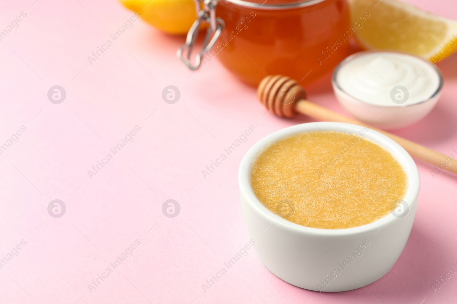 Photo of Handmade face mask and different ingredients on pink background. Space for text