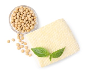 Photo of Delicious tofu cheese, basil and soybeans isolated on white, top view