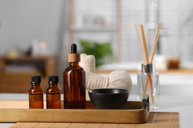 Photo of Spa products on white table in bathroom