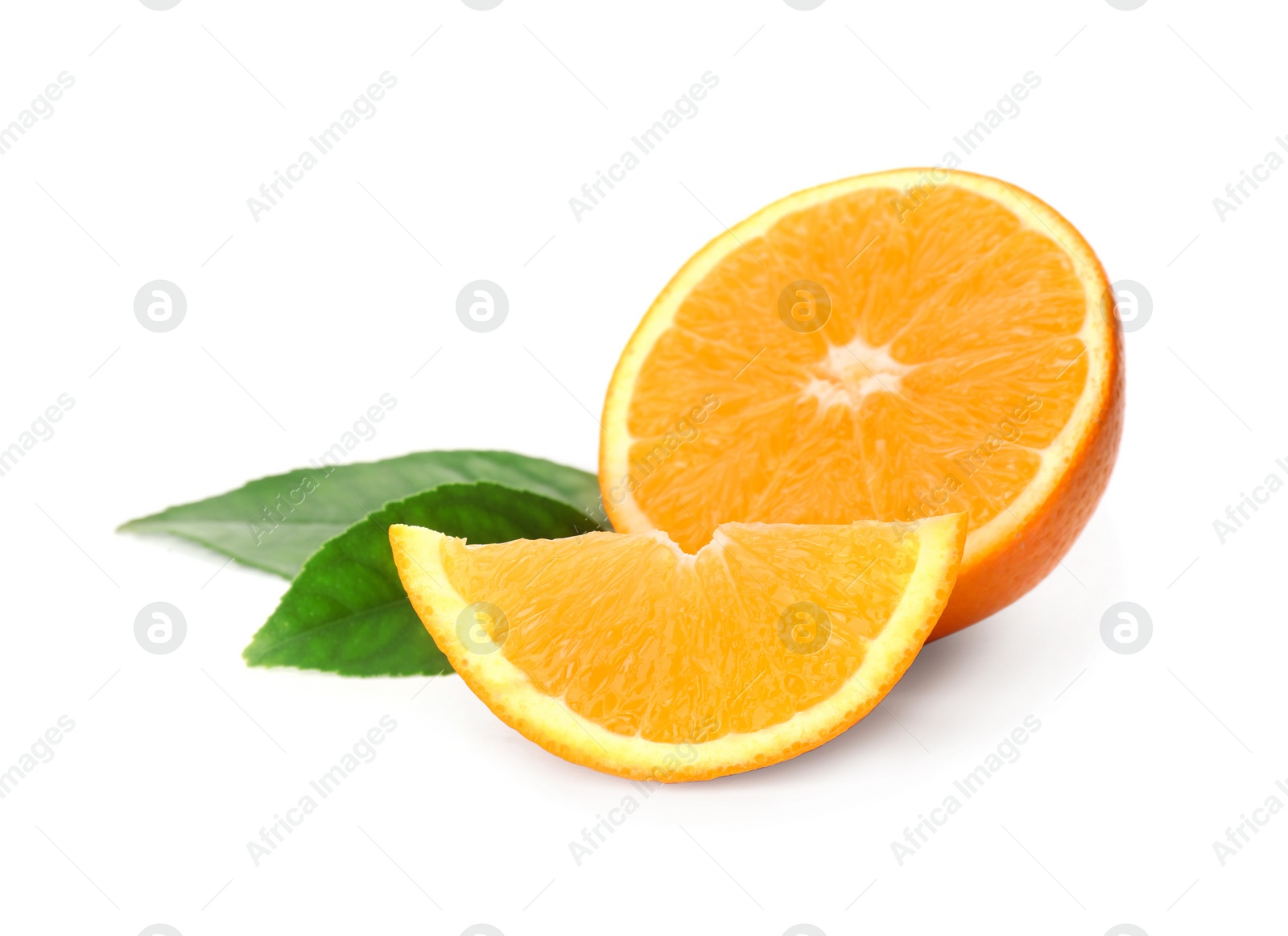 Photo of Cut fresh ripe orange with green leaves on white background