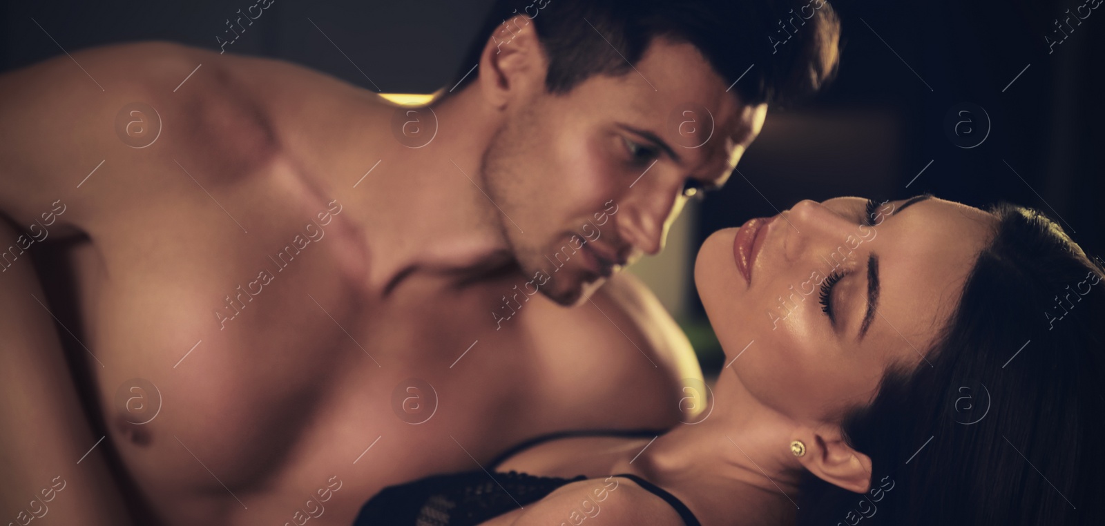 Image of Passionate young couple having sex at home. Banner design