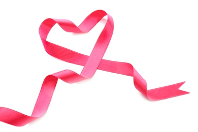 Photo of Heart made of pink ribbon on white background