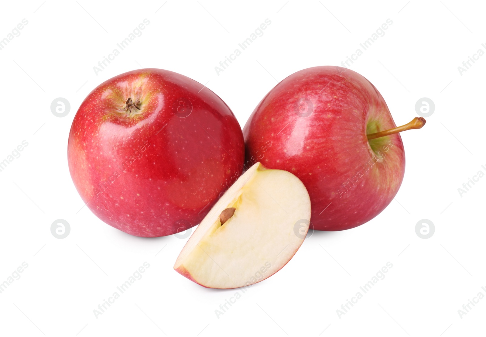 Photo of Whole and cut red apples isolated on white