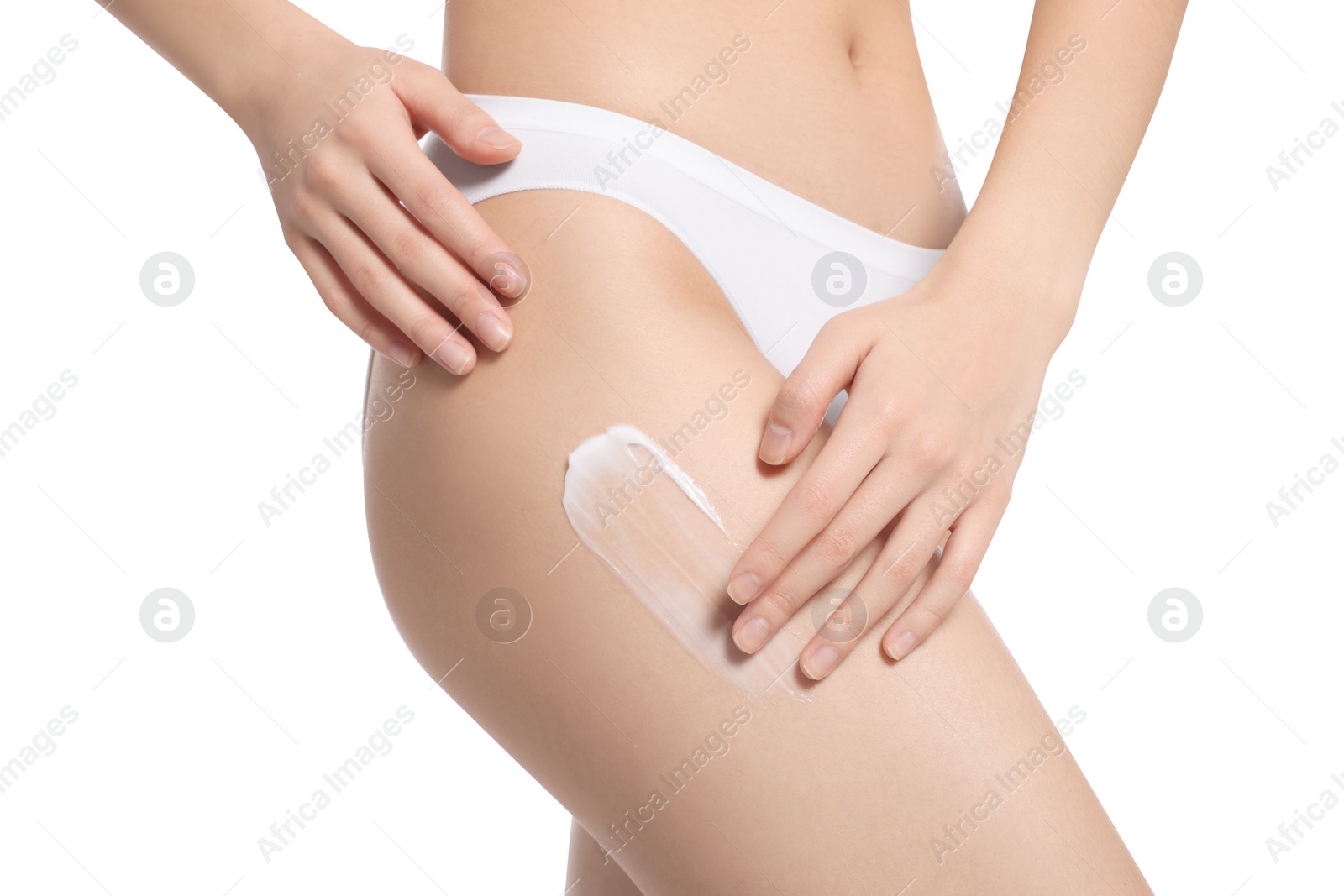 Photo of Woman with body cream smear on hip against white background, closeup