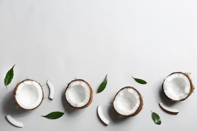 Composition with coconuts on white background, top view