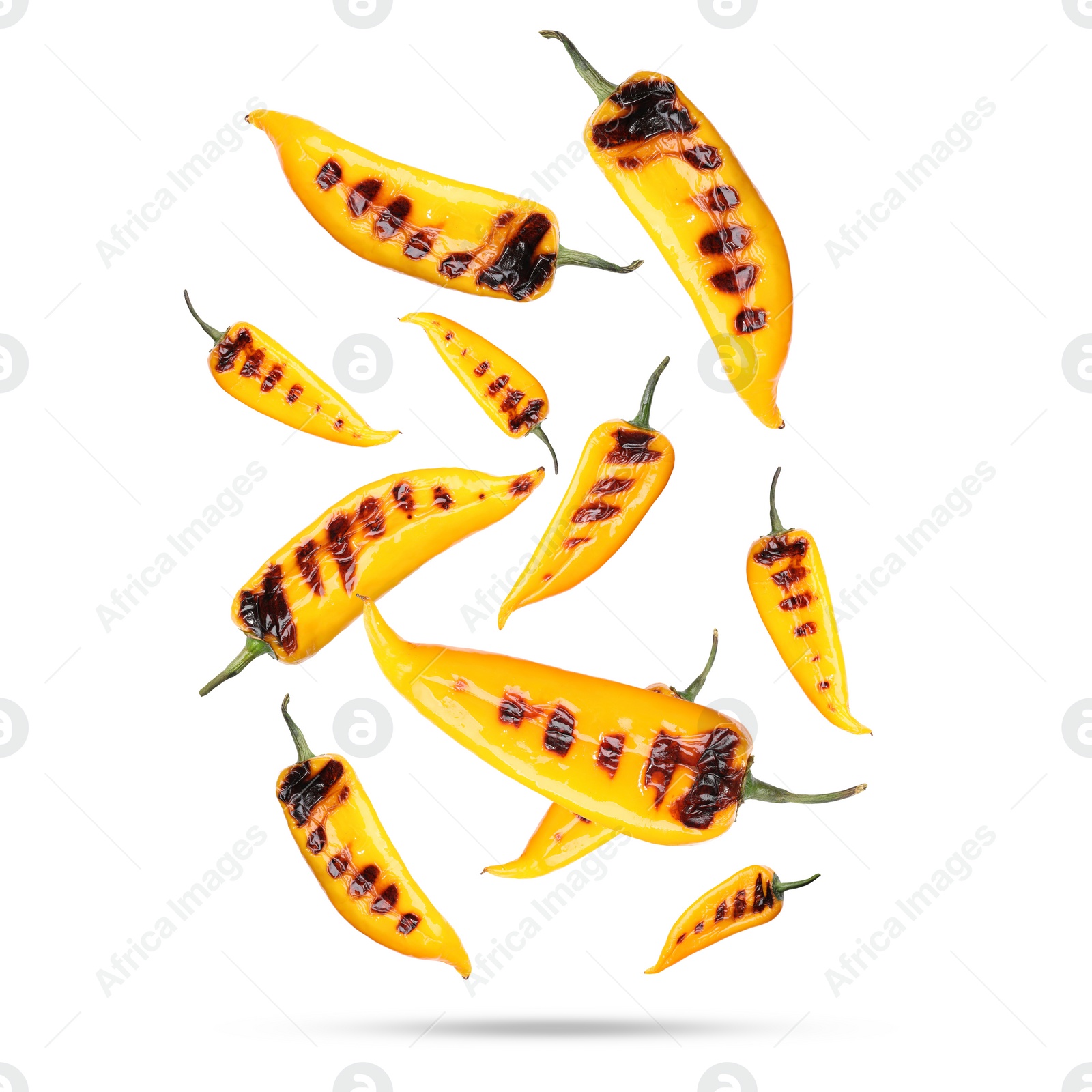 Image of Grilled peppers in air on white background