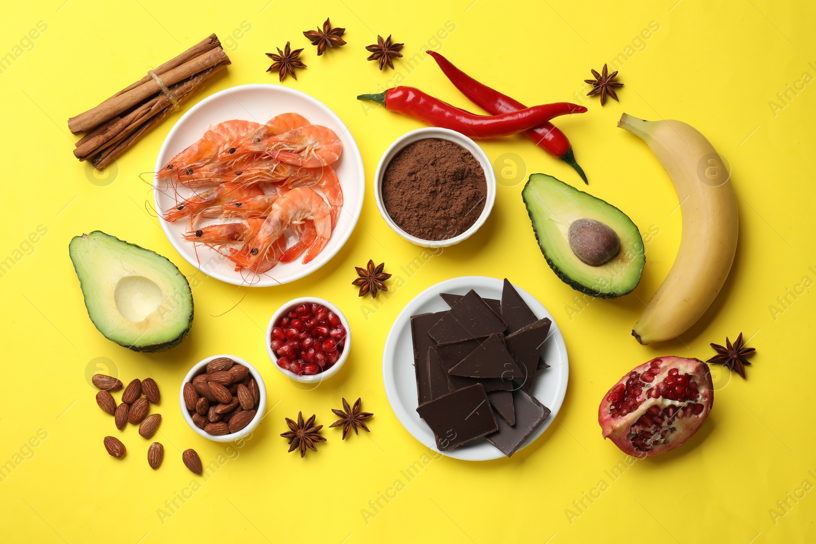 Photo of Natural aphrodisiac. Different food products on yellow background, flat lay