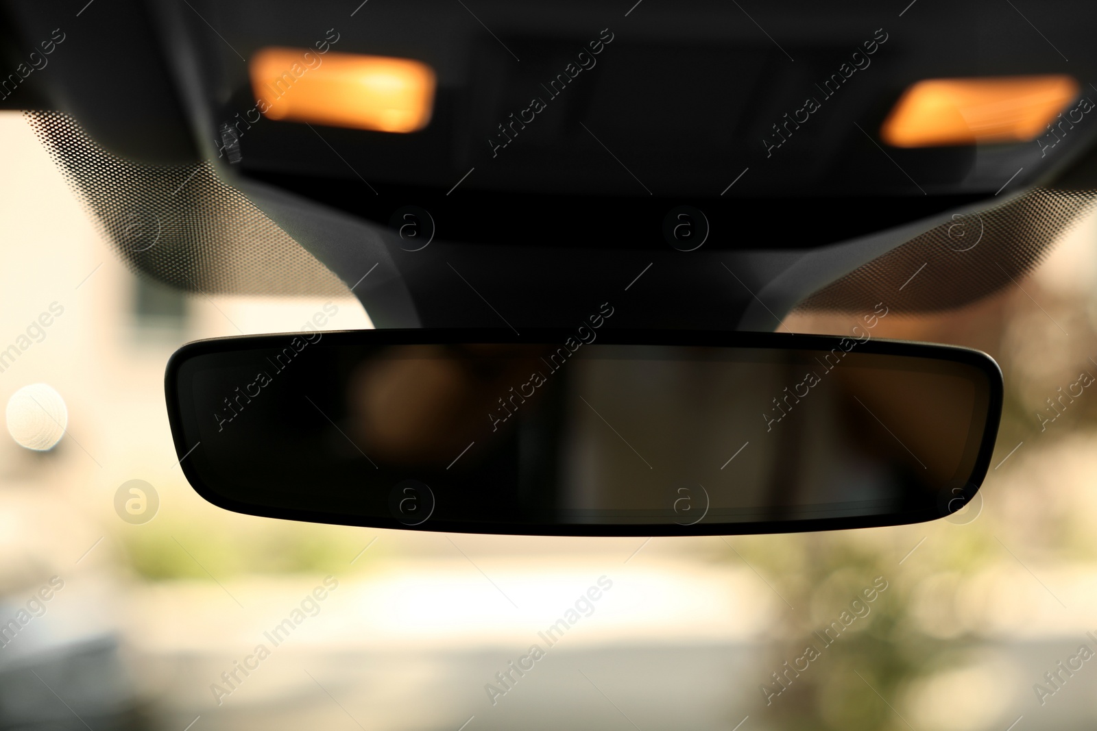 Photo of Clean rear view mirror in car, closeup